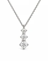 Three graduated round stones on a delicate white-metal chain