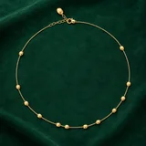 Nanis Soffio Necklace on emerald suede