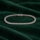 Anniversary Tennis Bracelet on emerald suede